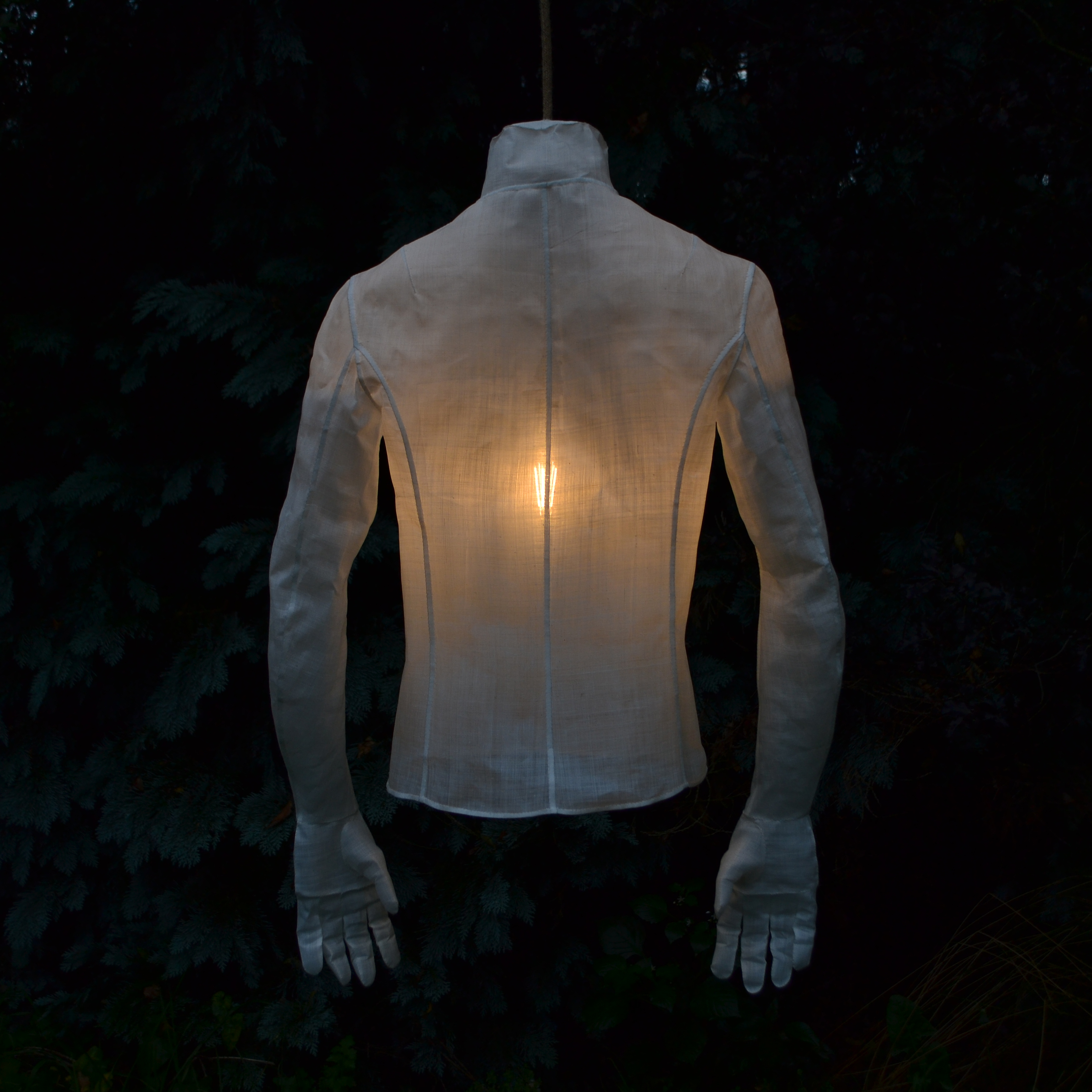 Hand-sewn ramie replica of the artist's upper body as a lamp
