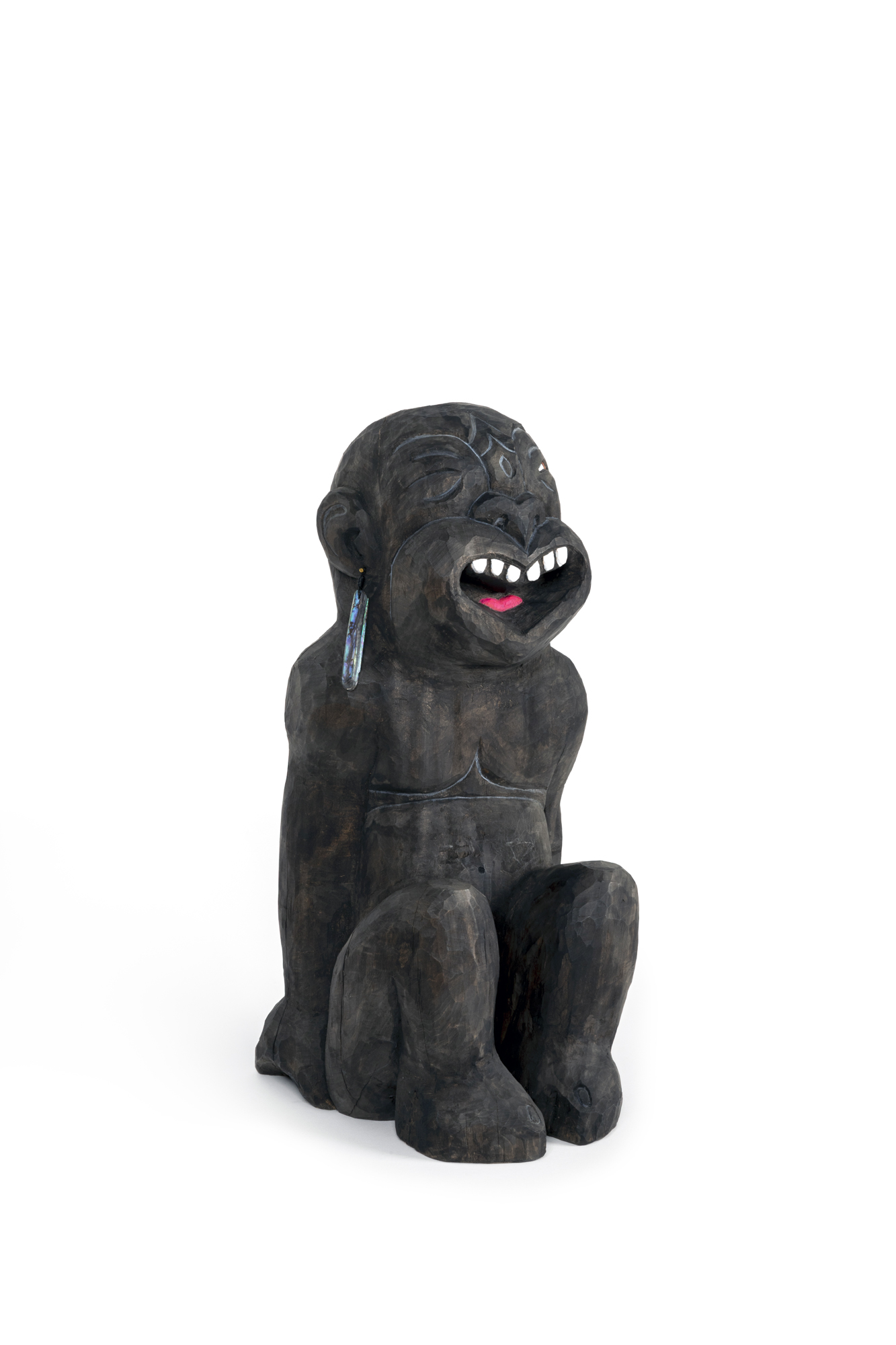 Wood carving of a laughing tekoteko