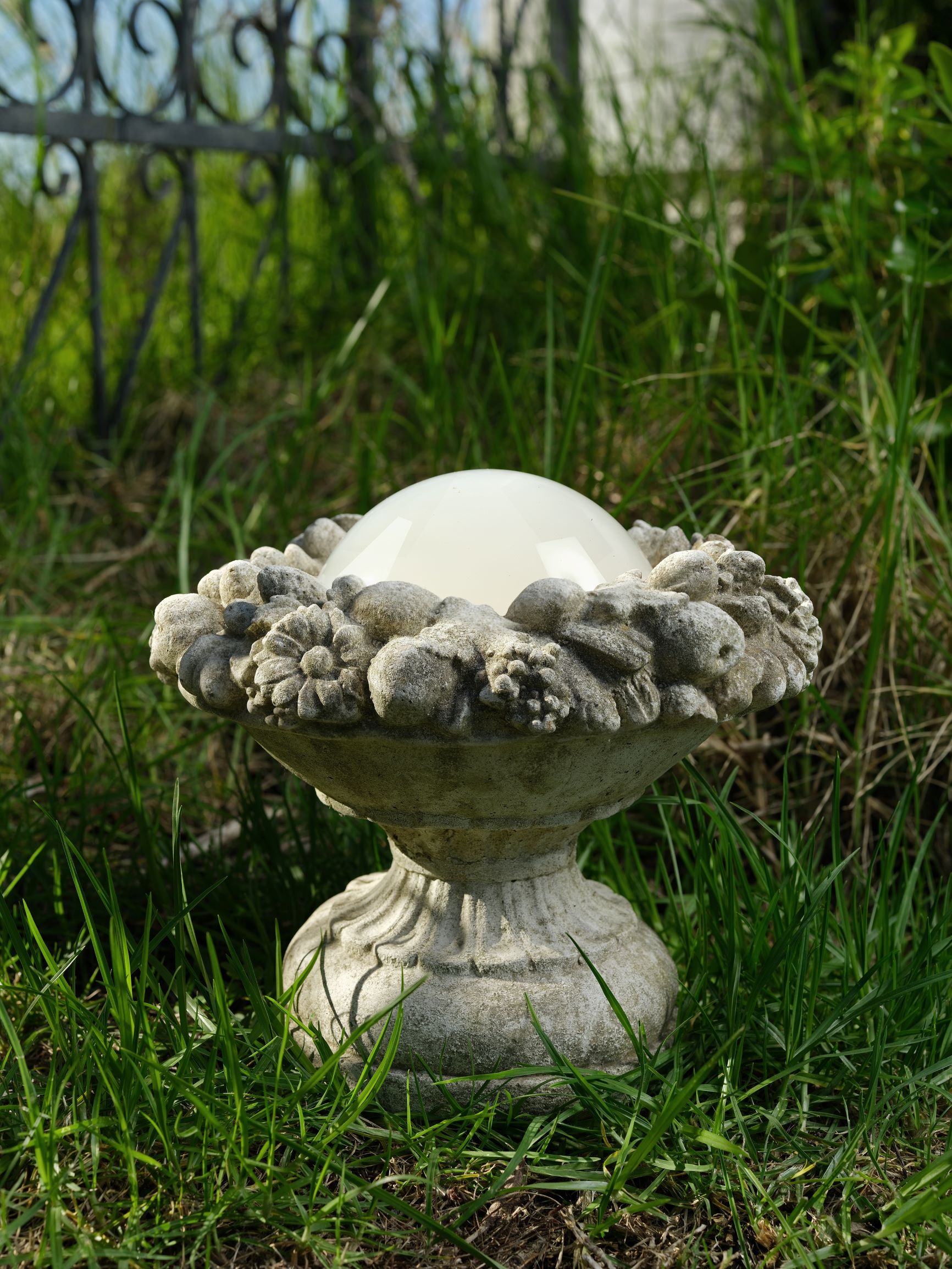 Yvonne Todd photograph of a concrete planter with gelatinous blob