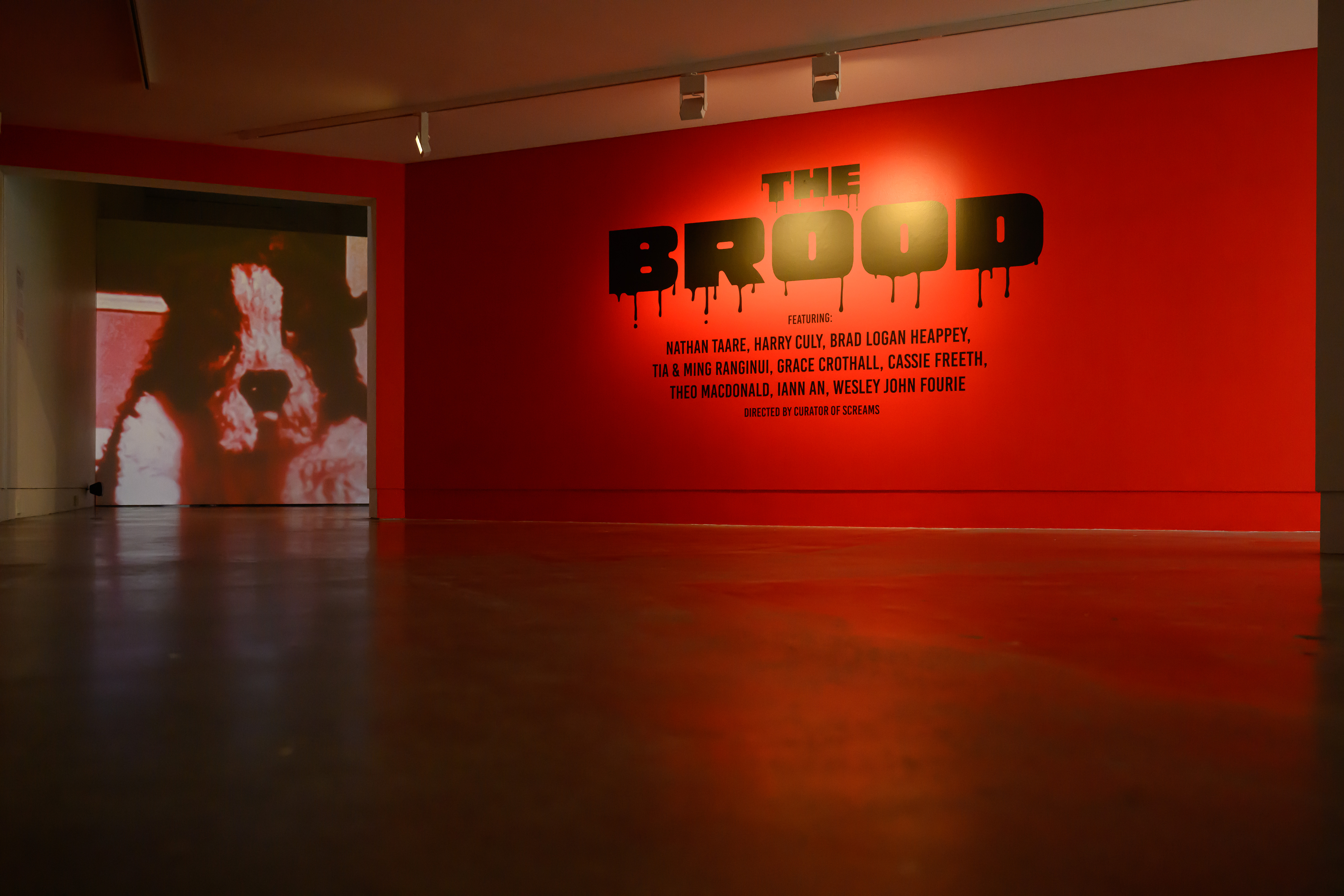 Install shot of demonic dog by Theo Macdonald and The Brood signage