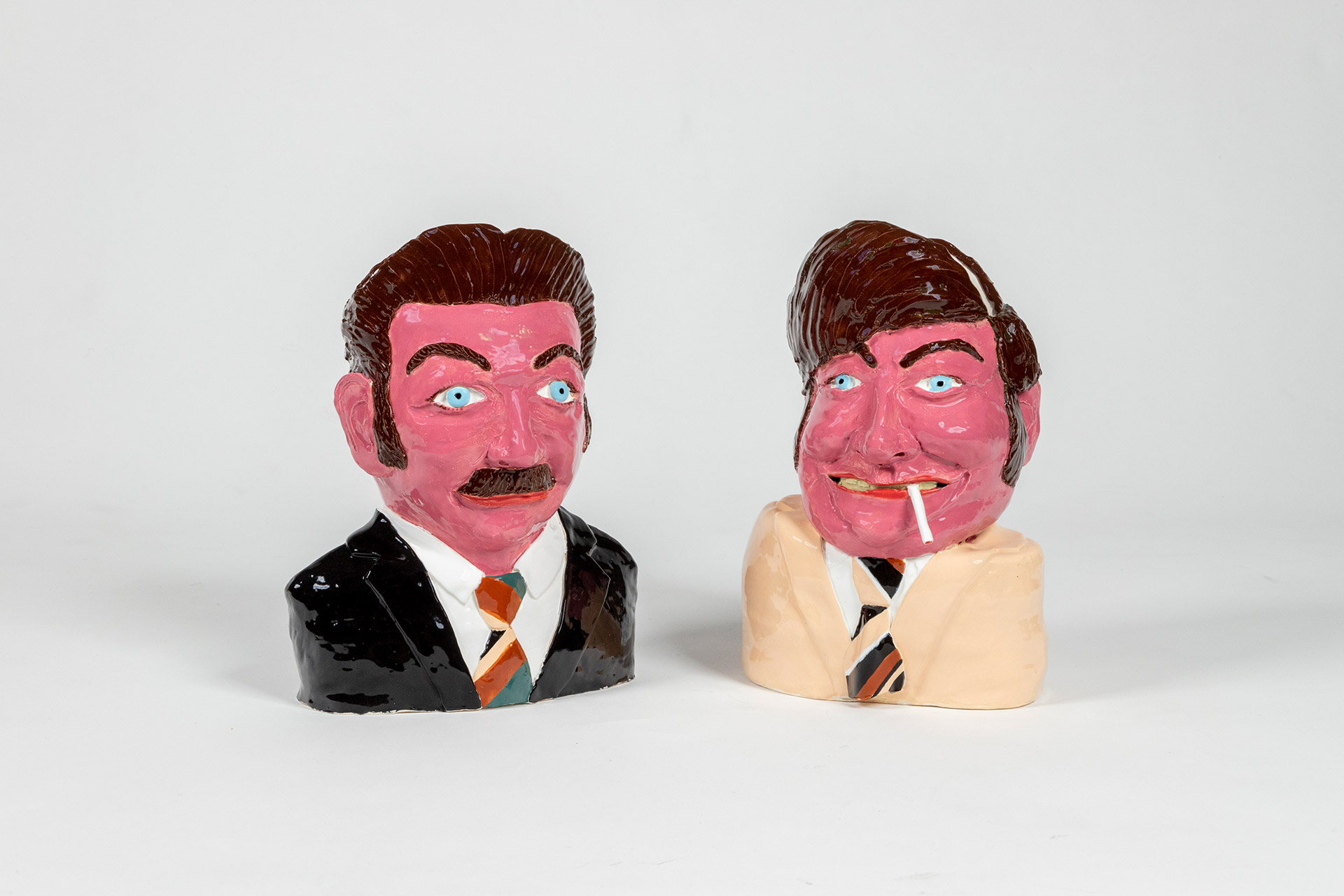 Sculpture of two ceramic heads by Paul Rayner.