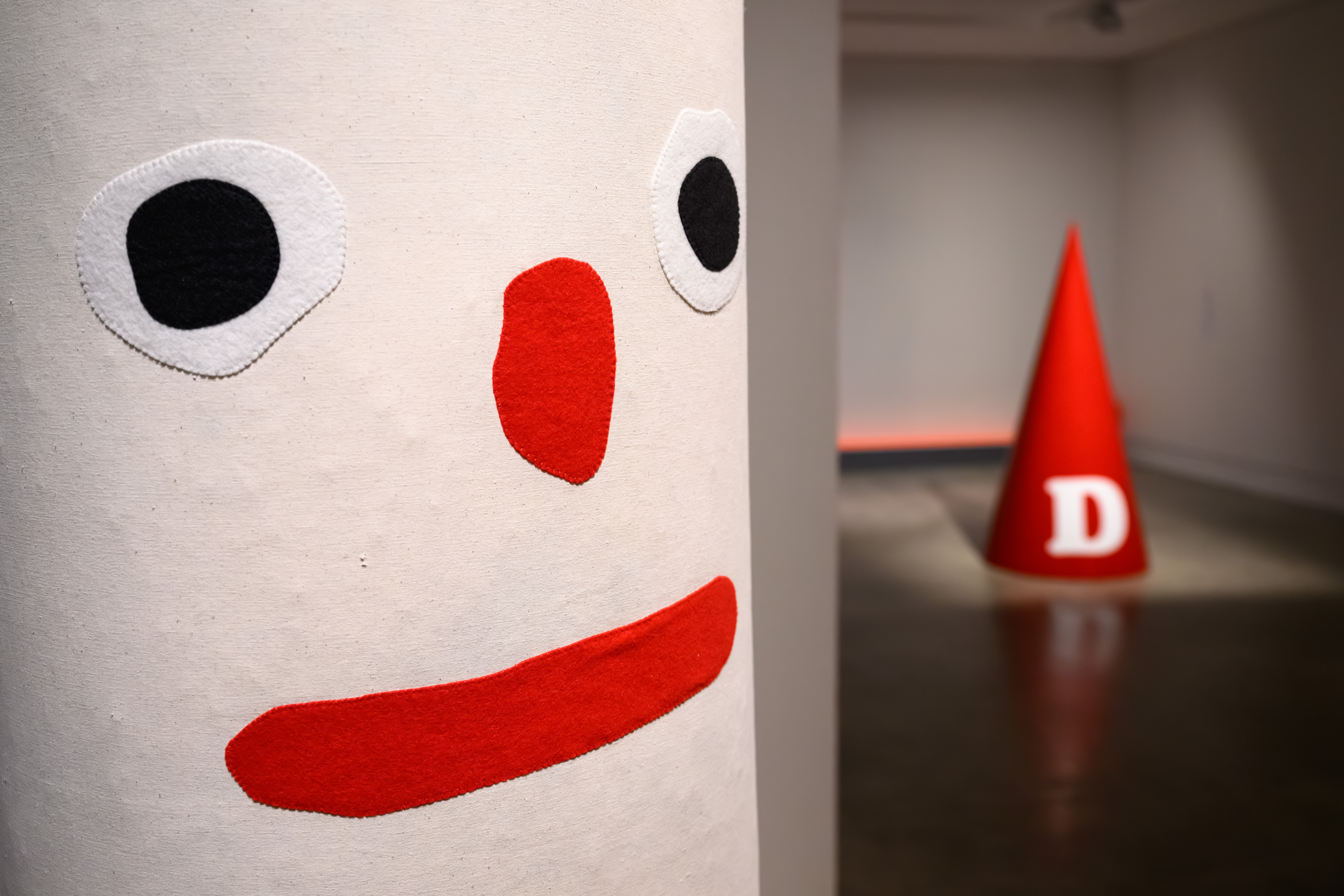 Back in Five install shot with punching bag and dunce cap